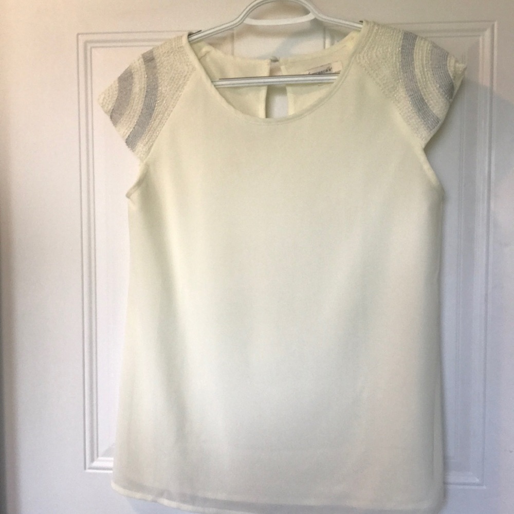 Francesca’s cream top with beaded sleeves